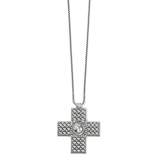 A silver-colored Brighton cross necklace with intricate detailing and a bold center bead, outlined with tiny silver beading. Brighton