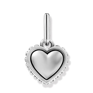 A silver-plated heart-shaped charm with beaded details. Brighton