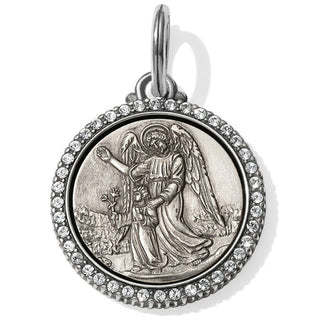 A silver-plated angel amulet with a round frame and a central angel figure, adorned with small diamonds. Brighton