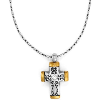 A mixed-metal cross necklace with a silver and gold-tone pendant, featuring a brilliant crystal at the center, on a chain. Brighton Venezia Petite Cross Necklace