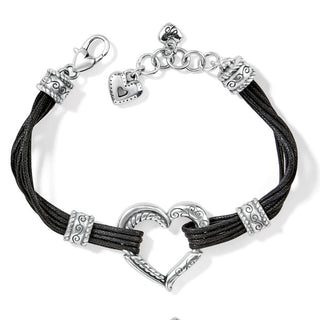 A black bracelet with a silver-plated lobster claw closure, featuring a bold sculptural heart in the center. Brighton Heritage Heart Bracelet Black