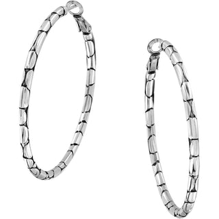 A pair of silver-colored large hoop earrings with a pebble pattern design. Brighton Pebble Large Hoop Earrings