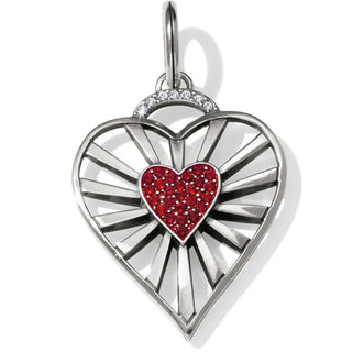 Heart-shaped pendant with a red gemstone center on a white background. Brighton Vibrant Heart Amulet