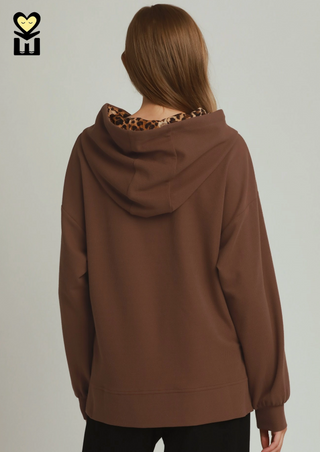 Brushed Waffle Knit Animal Print Hoodie in Cocoa Powder
an oversized brown hoodie with a leopard-print lining visible inside the hood, animal print drawstring soft long sleeve