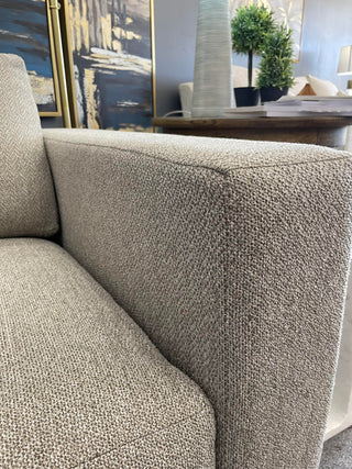 A close up on the arm design of the Burton James Habitat Chair