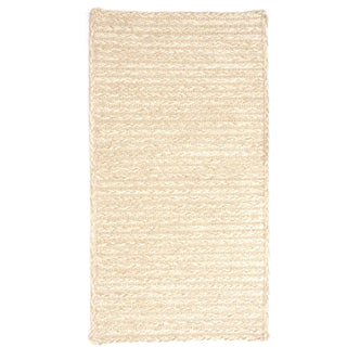 A beige, textured polypropylene braided rug with a scalloped edge design, suitable for indoor or outdoor use.