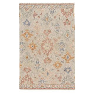 A rectangular wool rug with a natural multi-colored design, featuring geometric and floral patterns.