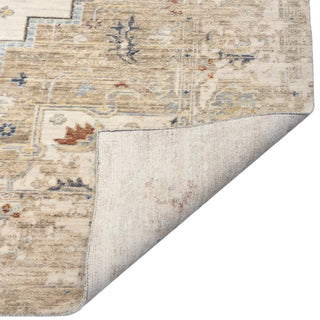 Capel Manor Taupe 9'x12'6" Rug
A close-up of a traditional area rug with a faded beige, cream, and light blue pattern,