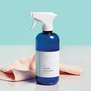 Capri Blue Volcano multi-surface cleaner on a blue background