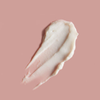 Watery Moon Hand Cream on a pink background