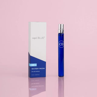 A Capri Blue Watery Moon perfume spray pen, with the brand's logo, in a blue and white packaging.