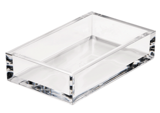 A clear acrylic guest towel holder designed to hold napkins.