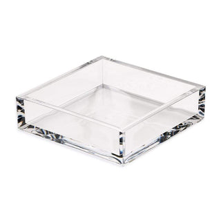 A clear acrylic luncheon napkin holder on a white background