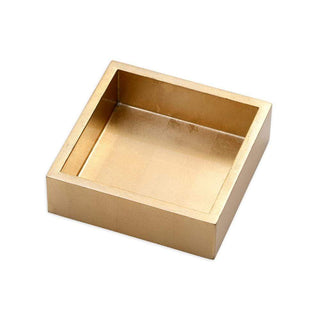 Gold lacquer luncheon napkin holder against a white background