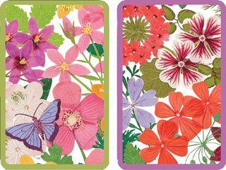 Two decks of playing cards with floral and butterfly designs on the back, packaged in a gold gift box.