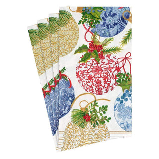 A set of Caspari porcelain ornament guest towels with a festive pattern featuring holiday ornaments in red, blue, and green colors.