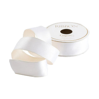 A spool of Caspari reversible satin ribbon in white and ivory, displayed alongside loose ends of the ribbon forming a loop.