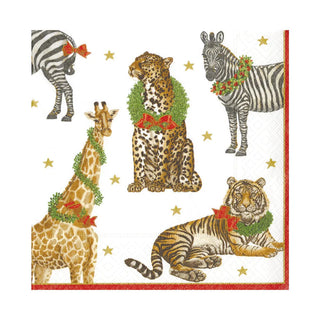 Caspari Wild Christmas Ivory Luncheon Napkins 
Decorative paper with Christmas-themed animals including a zebra, giraffe, leopard, and tiger, surrounded by wreaths and bows on a white background. red green brown star