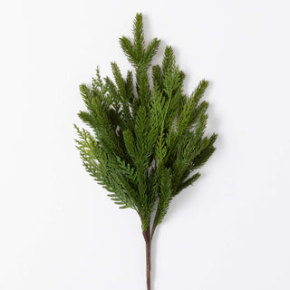 Artificial greenery branch on a white background