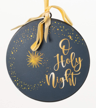 Decorative ornament with 'O Holy Night' text and star design on a dark blue background.