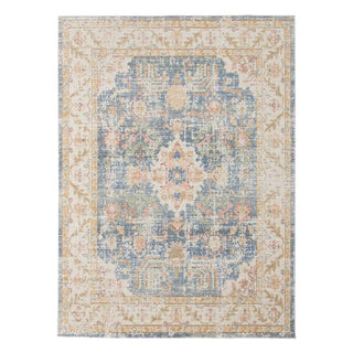 A rectangular indigo blue and beige area rug with a floral pattern and a geometric centerpiece. Century Indigo Rug