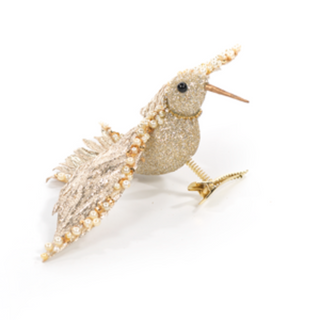 Decorative bird figurine with pearl-like details on a white background. Champagne Hummingbird