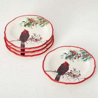 Set of decorative plates with cardinal and berry design on a white background