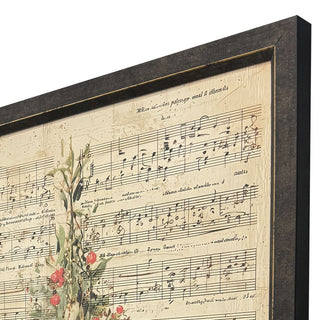 Christmas Tree Framed Print
Framed wall art featuring vintage sheet music on a warm beige background with botanical illustrations of red berries and green leaves, shown at an angle in a dark frame