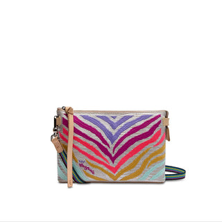 A multicolored Consuela Celeste Midtown Crossbody handbag with a woven strap and leather trim.