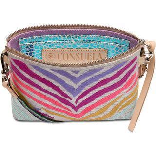 A multicolored Consuela Celeste Midtown Crossbody handbag with a woven strap and leather trim.