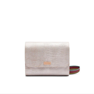 A Consuela Celeste On the Town Crossbody with a multicolored strap, closed and displayed against a plain background.