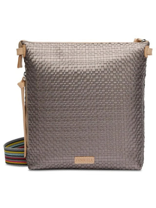 A gray Consuela Lex Tour Crossbody handbag with a geometric pattern, featuring a front slip pocket, side zip pocket, and an adjustable strap.