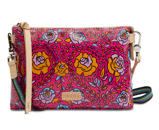 Colorful floral-patterned handbag with a multicolored woven strap on a white background