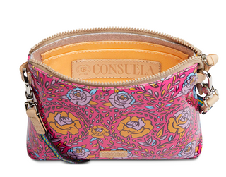 Pink floral patterned handbag with visible brand name on a white background