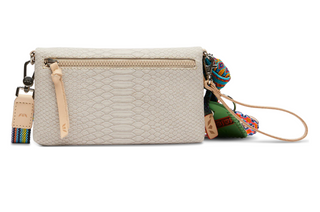 Beige textured crossbody bag with colorful strap on a white background