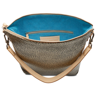 A Consuela Hobo bag with a gold and black metallic dotted pattern and a woven multicolored crossbody strap.