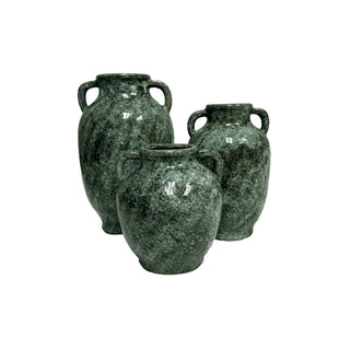 Three green ceramic vases on a white background