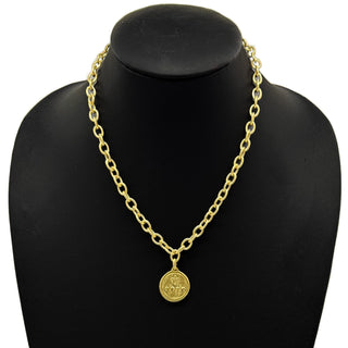 Gold chain necklace with a pendant of a bee on one side and fleur de lis on the other side.