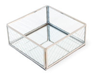 A clear glass cocktail napkin caddy with etched designs and silver trim, designed to hold two packages of cocktail napkins.
