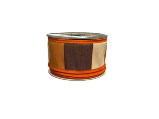 Spool of ribbon with brown, orange, and cream stripes