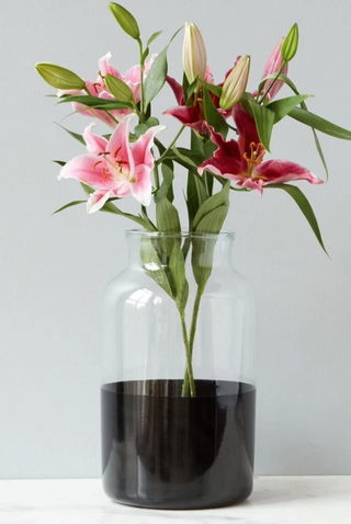 A large black colorblock mason jar vase with flowers. ETU