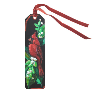 A rectangular black bookmark with a red ribbon loop, featuring a painted red cardinal perched on a green leafy branch with small white berries, shown on a plain white background. Elegant Cardinal Bookmark