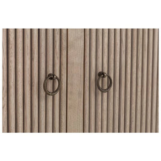 A wooden credenza with a white marble top, featuring four doors with brass hardware, set on short legs.