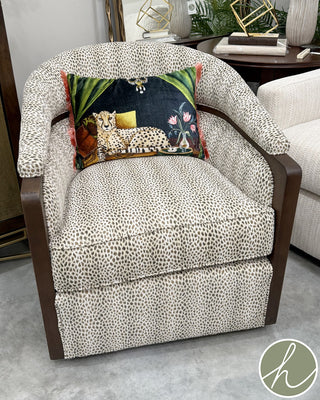 Cheetah print upholstered armchair with wood details