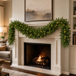 Foxtail Prelit Garland Warm White LED 9' x 14" Christmas
A green holiday garland with warm white string lights draped across a white fireplace mantel above a lit fire, set in a cozy living room.