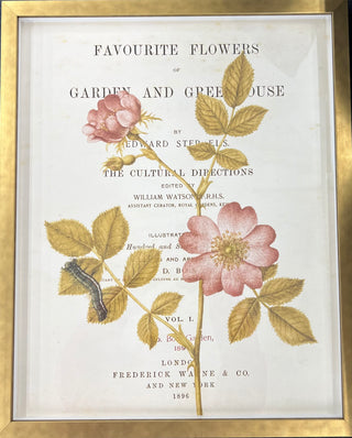 A framed vintage print featuring floral and butterfly illustrations with text on the title page.