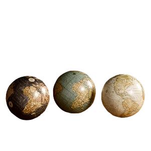 Globe orbs in a gray, turquoise, and cream color that can be used as home decor.