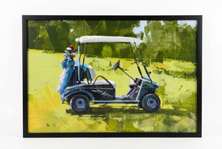 A framed art print depicting a golf cart on a green golf course. 