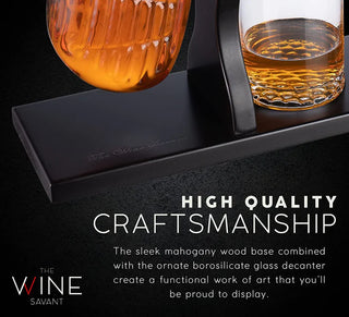 A whiskey decanter set featuring a golf club-shaped decanter and four whiskey glasses arranged on a mahogany wood base.