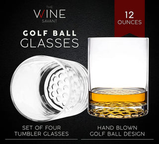 A whiskey decanter set featuring a golf club-shaped decanter and four whiskey glasses arranged on a mahogany wood base.